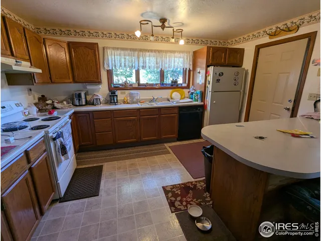 a view of a workspace with furniture