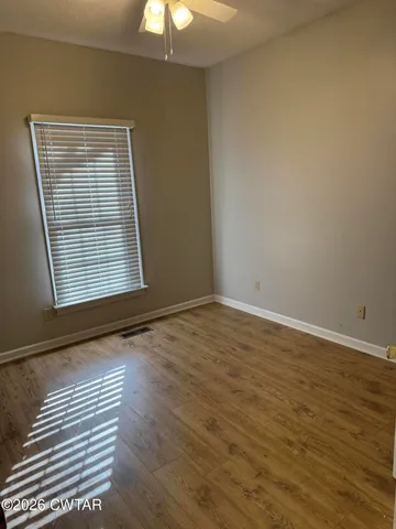 a white toilet sitting next to a bath tub and a shower