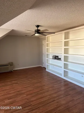 a view of a small space built with hardwood floor