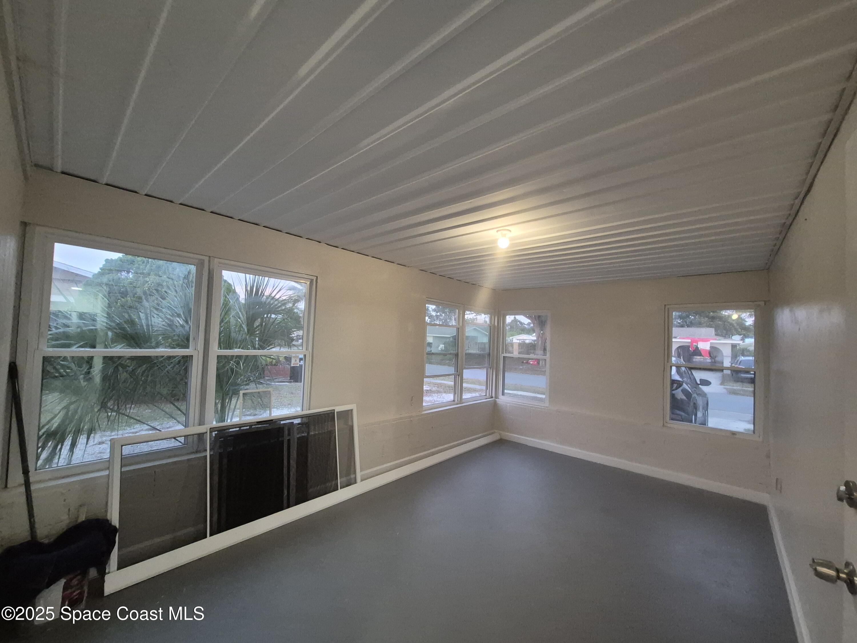 980 Bacon Circle Northeast Palm Bay, FL 32905 - Photo 39 of 50 a view of an empty room with a window