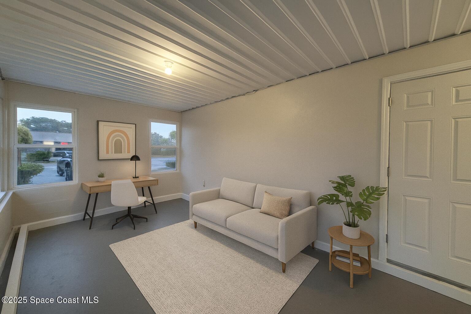 980 Bacon Circle Northeast Palm Bay, FL 32905 - Photo 42 of 50 a living room with furniture