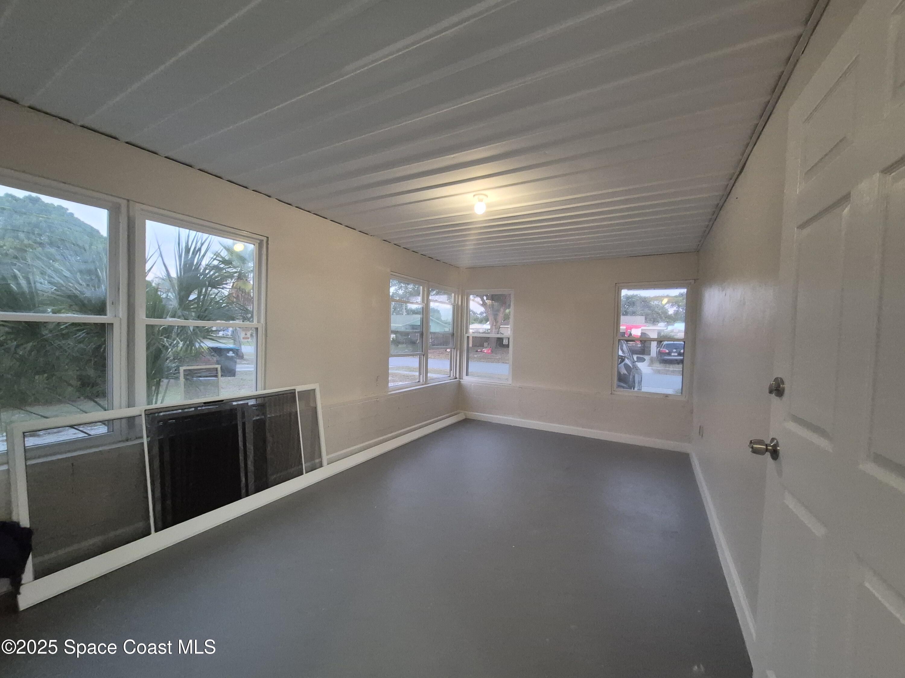 980 Bacon Circle Northeast Palm Bay, FL 32905 - Photo 43 of 50 a view of an empty room with a window