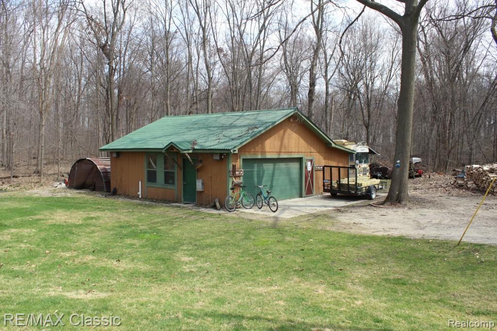 26760 Johns Road Wixom, MI 48393 - Photo 8 of 32 GARAGE WITH HEATED WORKSHOP