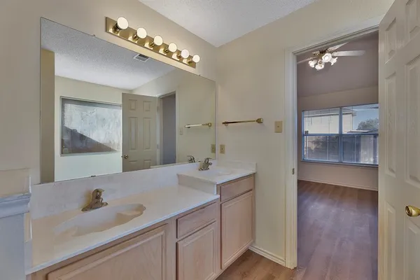a en suite bathroom with a sink and a mirror