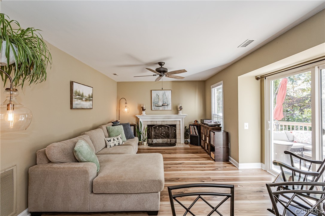 2908 Cove Ridge Trace Midlothian, VA 23112 - Photo 13 of 49 a living room with furniture a large window and a fireplace