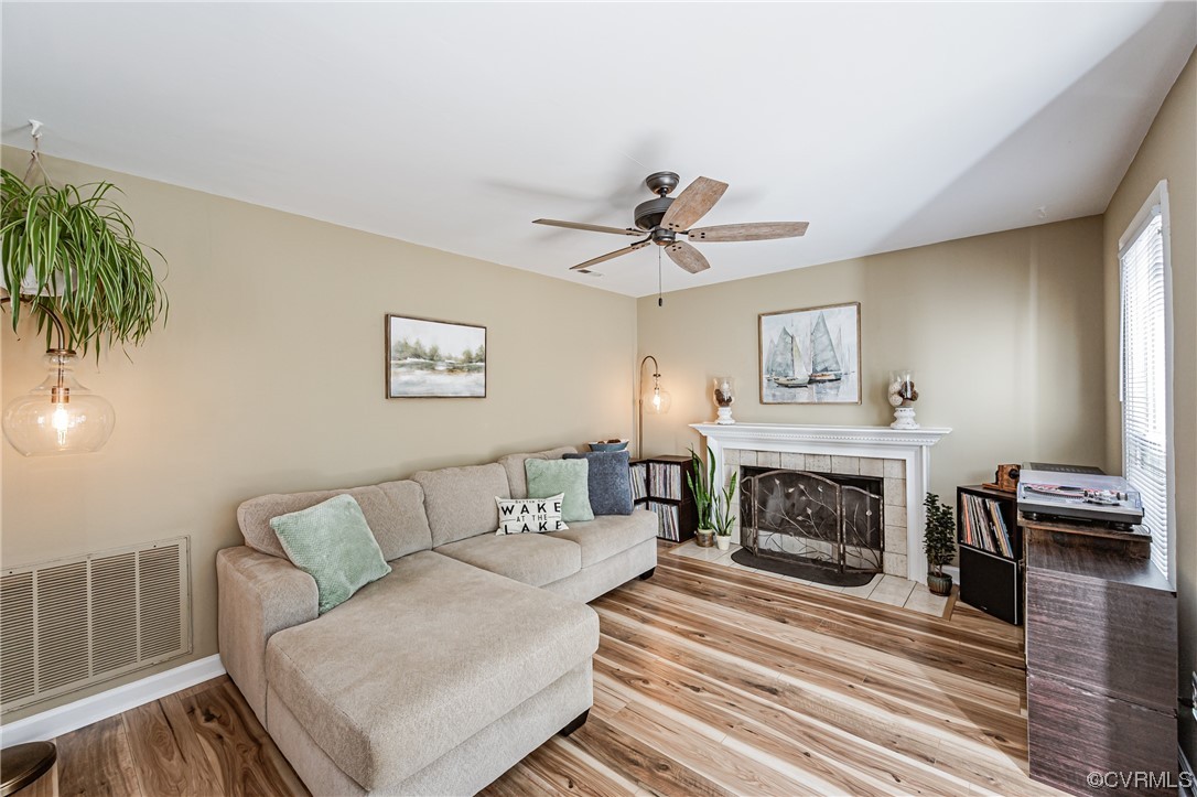 2908 Cove Ridge Trace Midlothian, VA 23112 - Photo 15 of 49 a living room with furniture and a fireplace