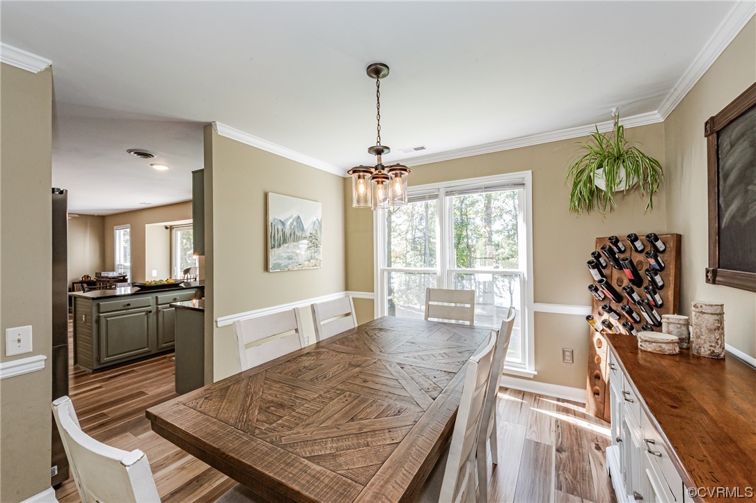 2908 Cove Ridge Trace Midlothian, VA 23112 - Photo 18 of 49 a view of a dining room with furniture window and wooden floor