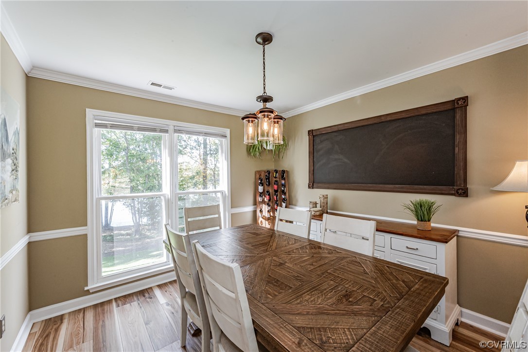 2908 Cove Ridge Trace Midlothian, VA 23112 - Photo 19 of 49 a view of a dining room with furniture window and wooden floor