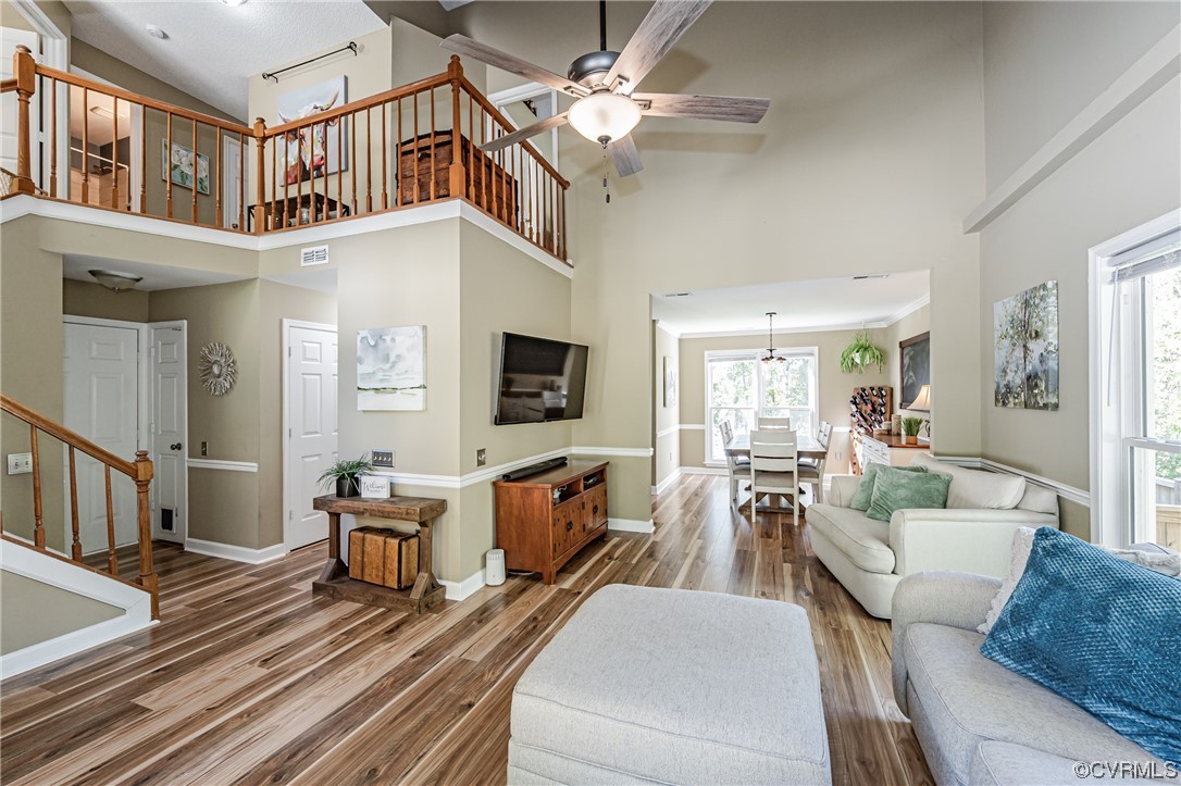 2908 Cove Ridge Trace Midlothian, VA 23112 - Photo 24 of 49 a living room with furniture a flat screen tv and a ceiling fan