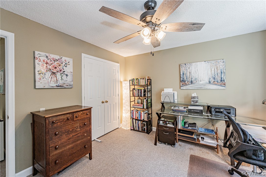 2908 Cove Ridge Trace Midlothian, VA 23112 - Photo 38 of 49 a view of a workspace with furniture and a ceiling fan
