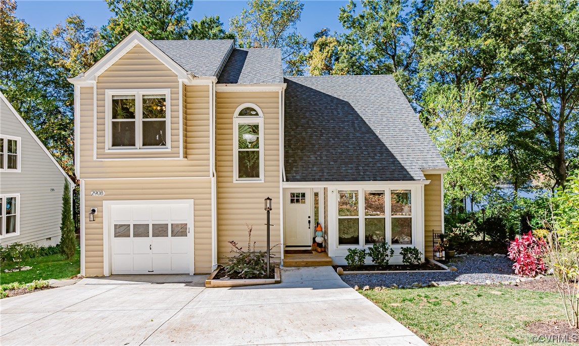 2908 Cove Ridge Trace Midlothian, VA 23112 - Photo 4 of 49 a front view of a house with a yard and potted plants