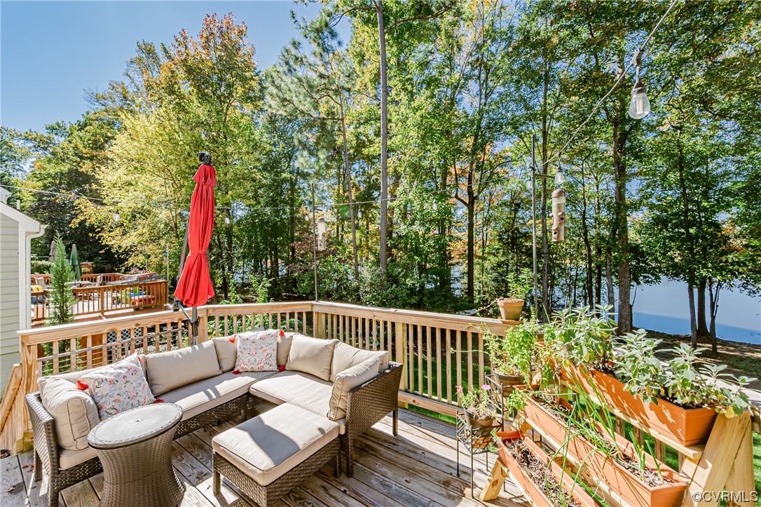 2908 Cove Ridge Trace Midlothian, VA 23112 - Photo 42 of 49 a balcony with wooden floor and outdoor seating
