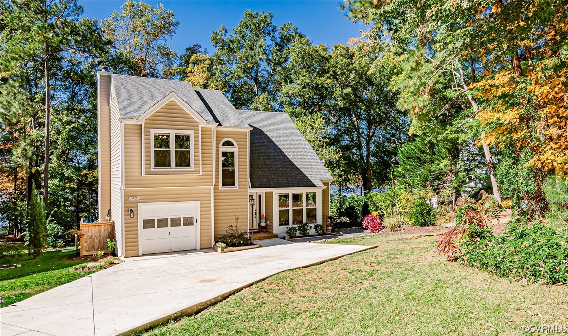 2908 Cove Ridge Trace Midlothian, VA 23112 - Photo 5 of 49 a front view of a house with a yard and trees