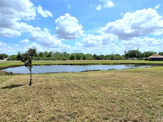 a view of a lake with a big yard