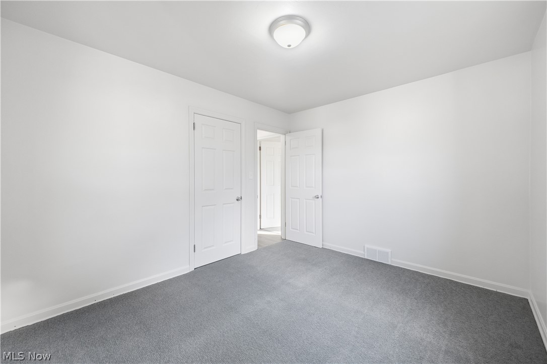 227 Wilson Street Struthers, OH 44471 - Photo 21 of 44 Empty room with baseboards and carpet flooring