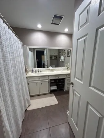 a bathroom with a sink a vanity and a mirror