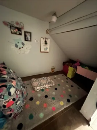 a bedroom with a bed and dresser