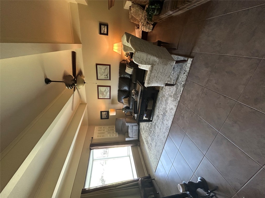 11121 Pinehurst Drive, Unit D Austin, TX 78747 - Photo 5 of 28 a living room with furniture and a window