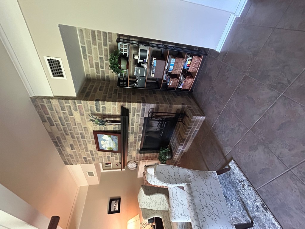 11121 Pinehurst Drive, Unit D Austin, TX 78747 - Photo 6 of 28 a living room with furniture and a fireplace