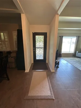 wooden floor in an empty room with a fireplace