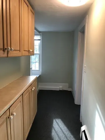 a view of cabinets and window