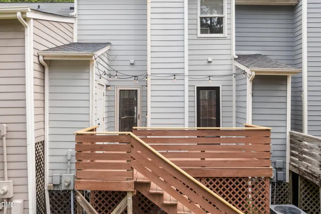a view of a patio with two chairs and a fire pit