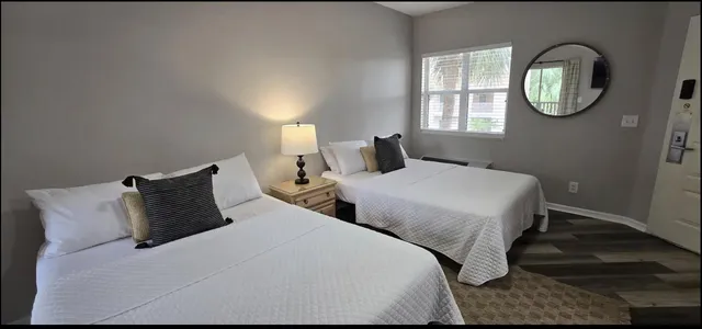 a bedroom with bed and a window