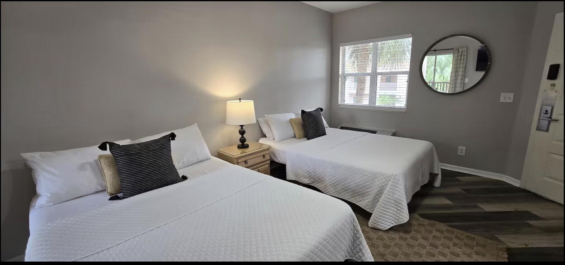 10047 Perfect Drive, Unit B Port St. Lucie, FL 34986 - Photo 5 of 13 a bedroom with bed and a window