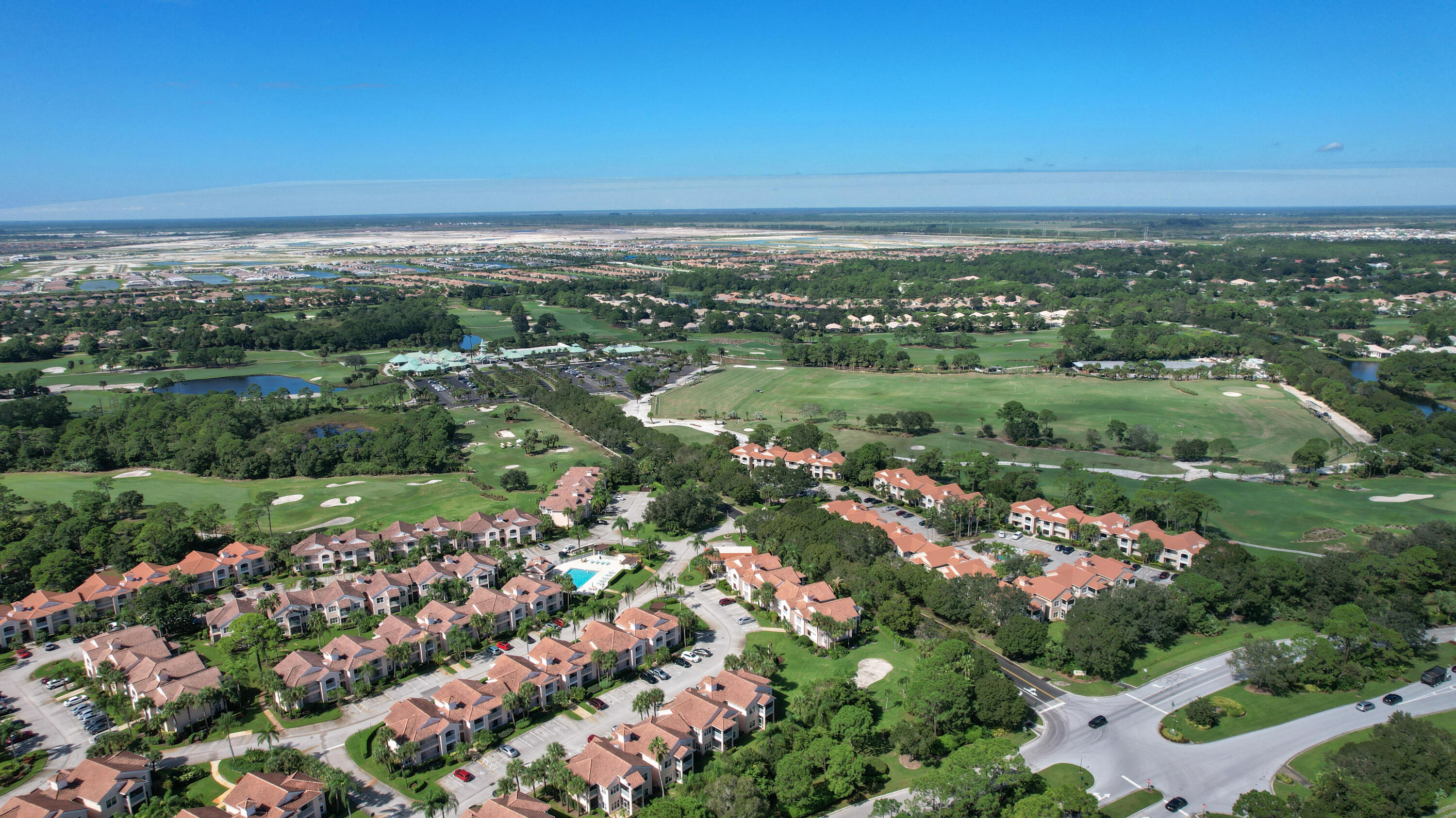10047 Perfect Drive, Unit B Port St. Lucie, FL 34986 - Photo 8 of 13 an aerial view of city and lake