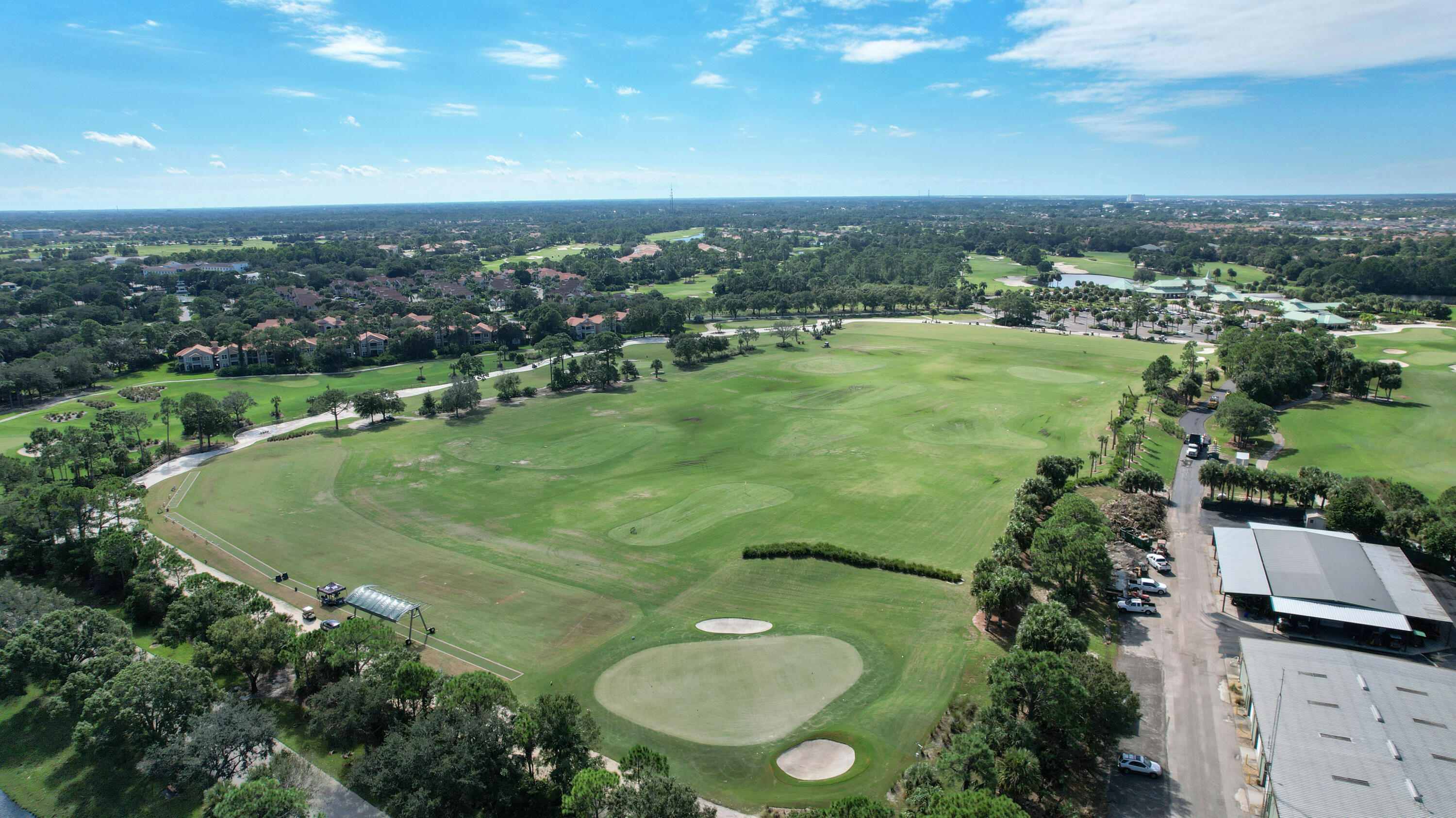10047 Perfect Drive, Unit B Port St. Lucie, FL 34986 - Photo 9 of 13 an aerial view of a residential houses with outdoor space and trees