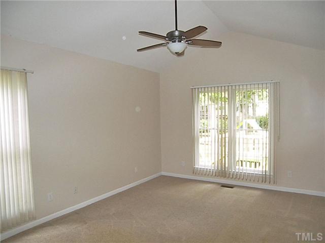 11940 Fairlie Place Raleigh, NC 27613 - Photo 14 of 25 a view of an empty room with a window