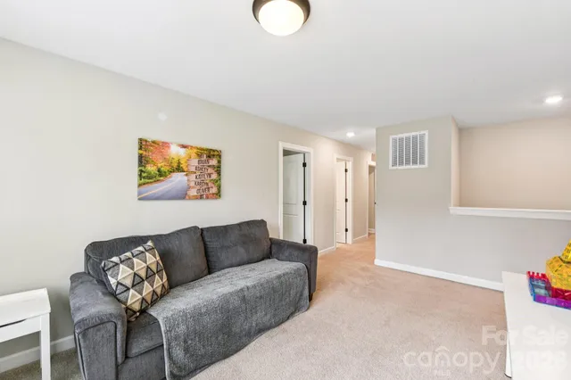 a living room with furniture and a rug