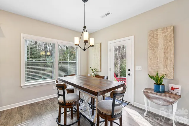 a view of a dining room with furniture window and outside view