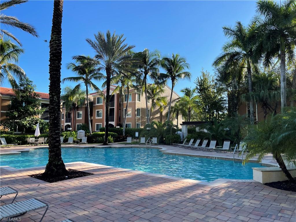 1130 Reserve Way, Unit 208 Naples, FL 34105 - Photo 13 of 14 a view of a yard with palm trees