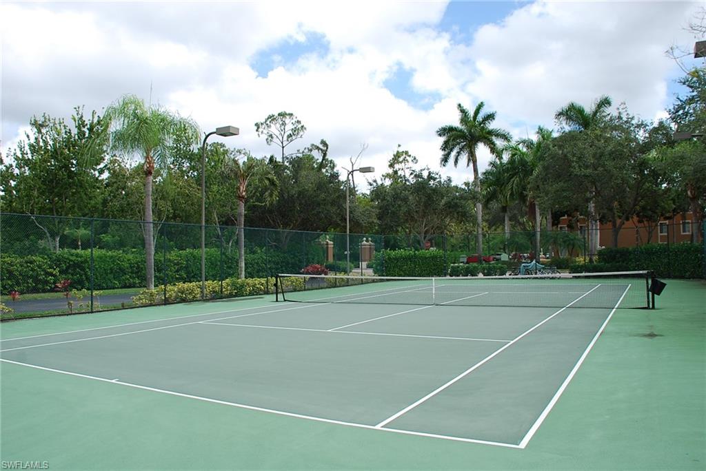 1130 Reserve Way, Unit 208 Naples, FL 34105 - Photo 9 of 14 a view of a tennis court