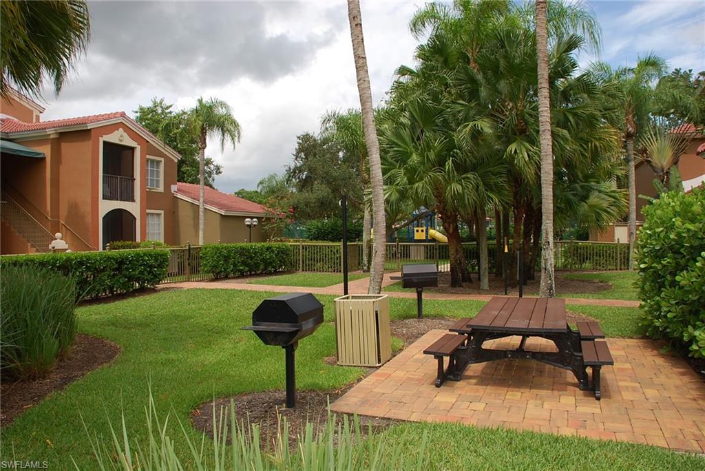 1130 Reserve Way, Unit 208 Naples, FL 34105 - Photo 10 of 14 a garden view with a seating space