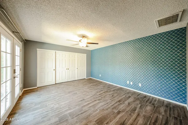 a view of an empty room with a window