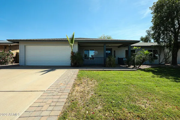 a house view with a garden space