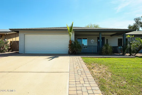 a view of outdoor space and front view of a house