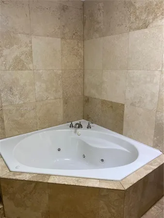 a bath tub sitting in a bathroom