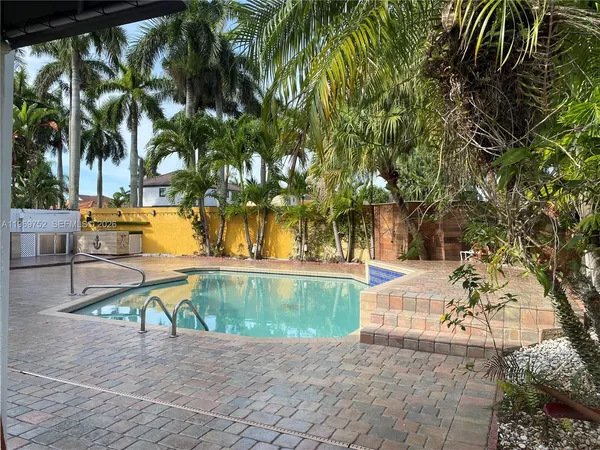 a view of a swimming pool with a patio