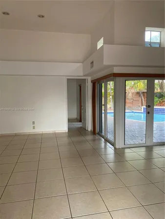 a view of an empty room and window