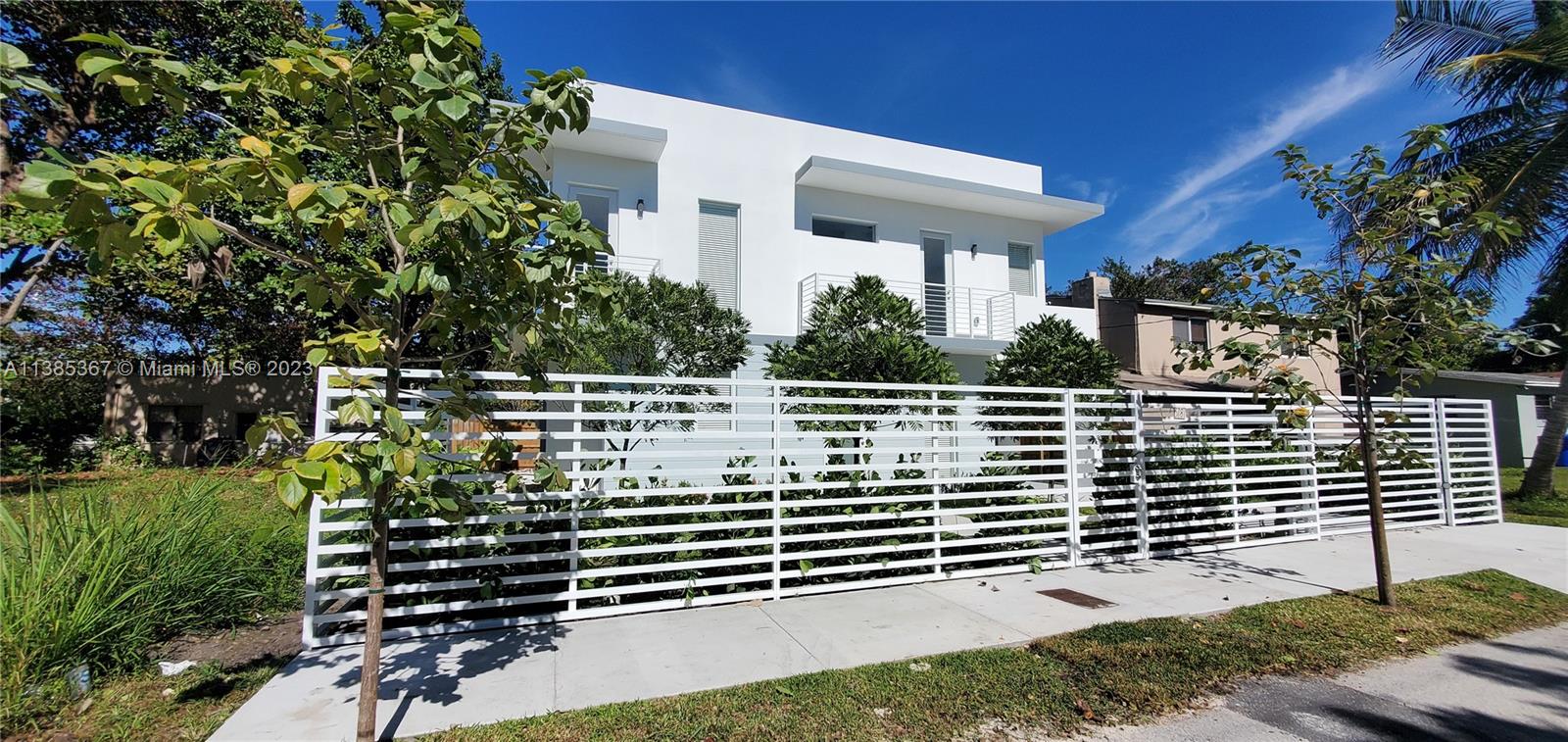 a side view of a house with a yard