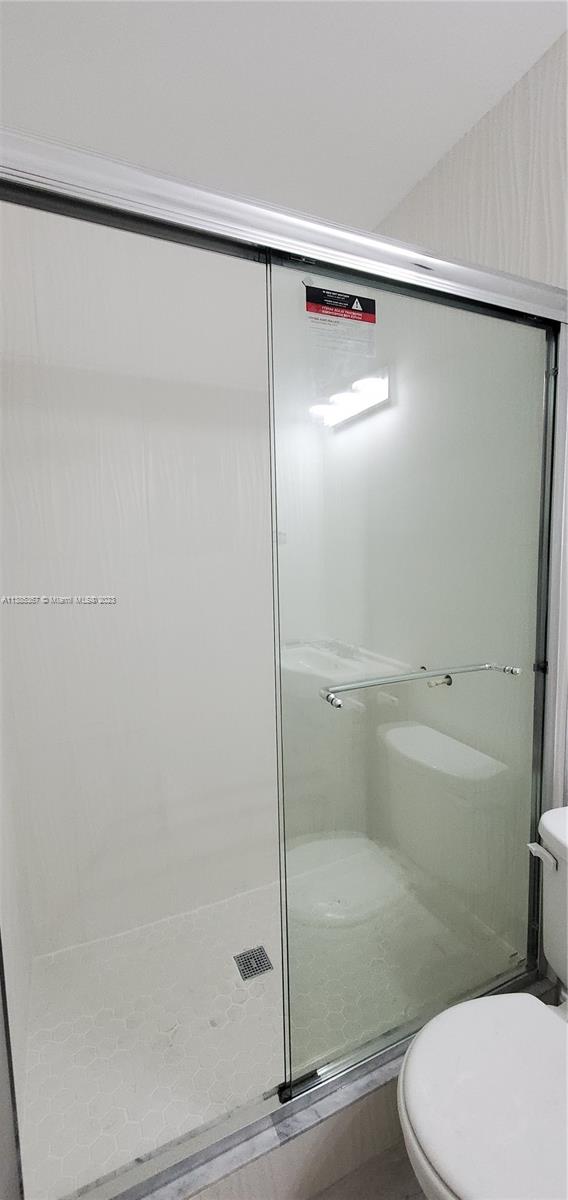 3787 Thomas, Unit 3787 Miami, FL 33133 - Photo 12 of 22 a bathroom with a shower and a toilet