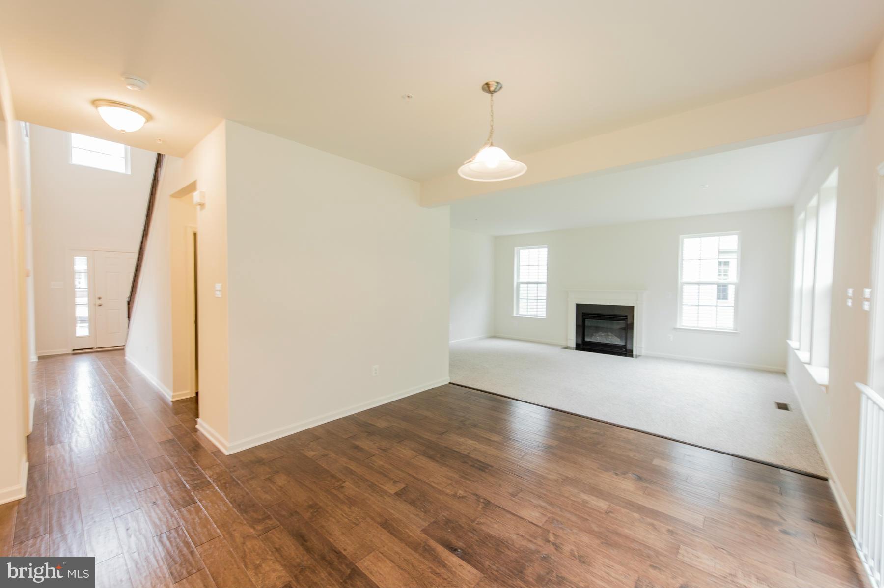 10515 Braddock Run Road Middle River, MD 21220 - Photo 12 of 27 a view of empty room with wooden floor and fan
