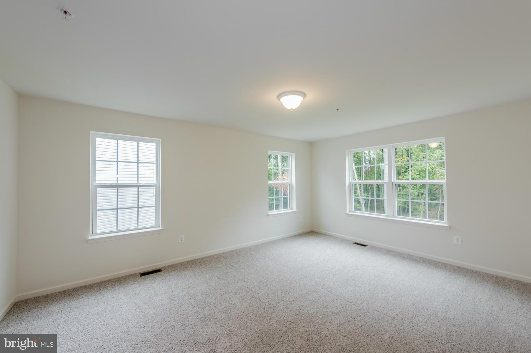 10515 Braddock Run Road Middle River, MD 21220 - Photo 17 of 27 an empty room with a window