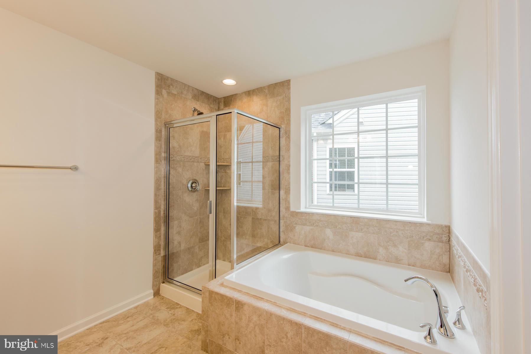10515 Braddock Run Road Middle River, MD 21220 - Photo 20 of 27 a bathroom with a bathtub and shower