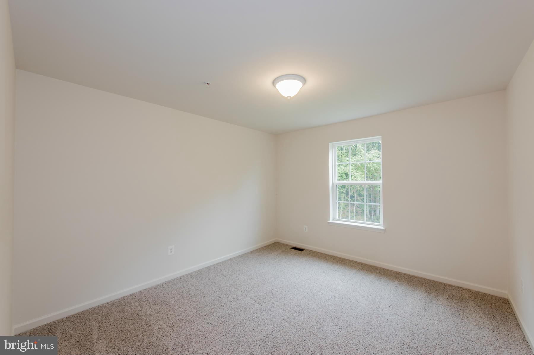 10515 Braddock Run Road Middle River, MD 21220 - Photo 26 of 27 an empty room with a window