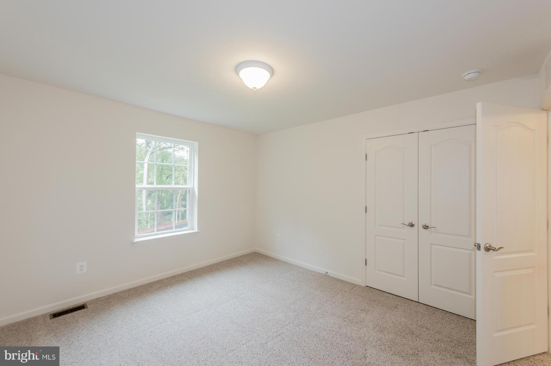 10515 Braddock Run Road Middle River, MD 21220 - Photo 27 of 27 an empty room with windows