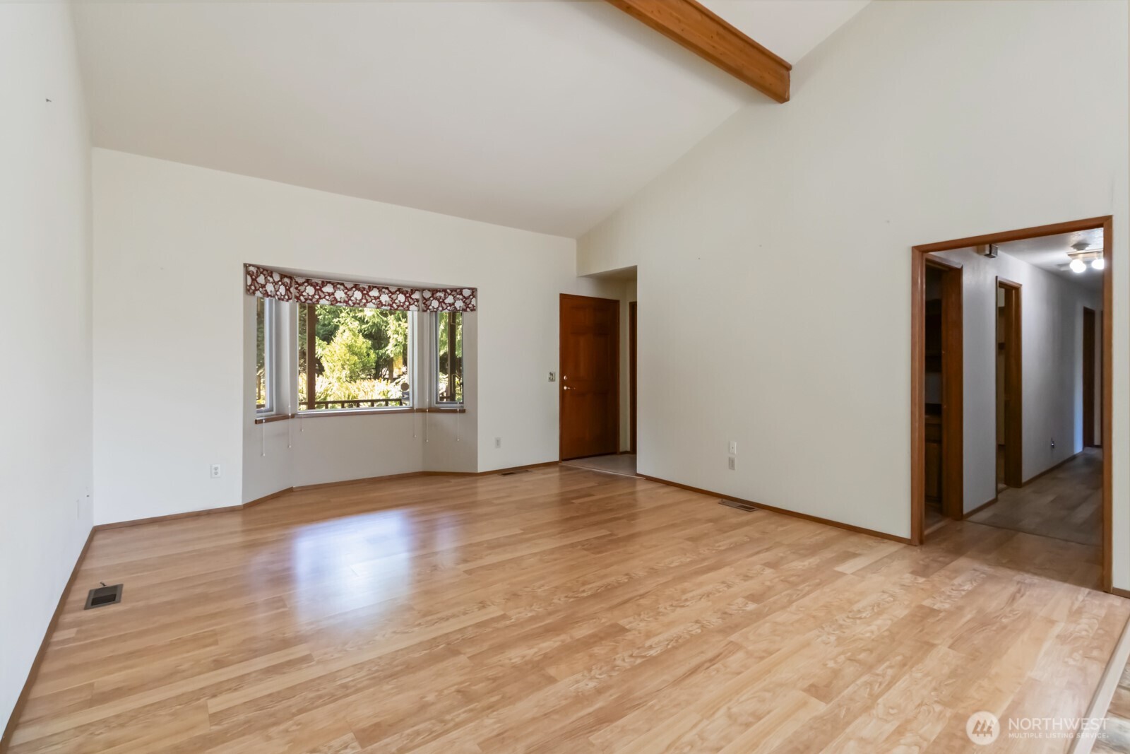 207 Tillicum Drive Chehalis, WA 98532 - Photo 19 of 40 an empty room with wooden floor and windows